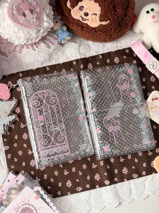 Transparent Rose Romance A7 binders decorated with pink roses and ornate gate and chair motifs.